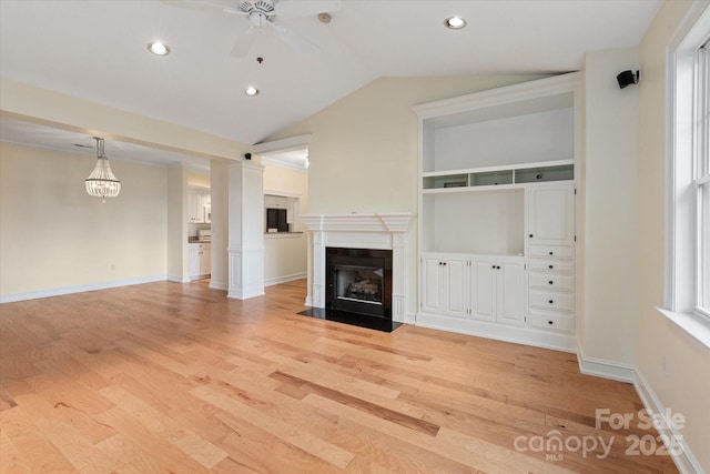 5601 Fairview Rd Unit 11, Charlotte, NC 28209 - unfurnished living room with a fireplace with flush hearth, a ceiling fan, light wood-style flooring, lofted ceiling, and recessed lighting