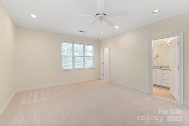 5601 Fairview Rd Unit 11, Charlotte, NC 28209 - unfurnished bedroom with light colored carpet, baseboards, crown molding, recessed lighting, and connected bathroom