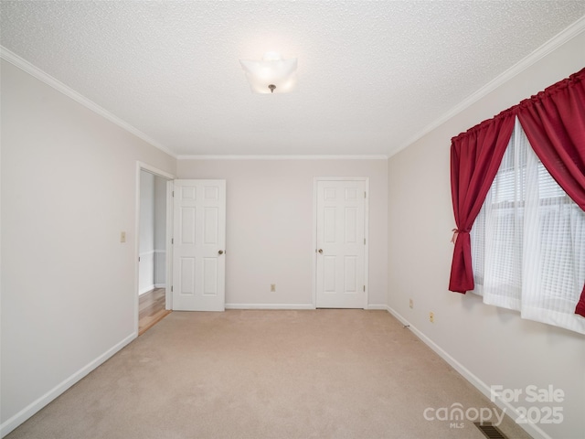 321 Jupiter Rd, Weaverville, NC 28787 - empty room with carpet floors, baseboards, crown molding, and a textured ceiling