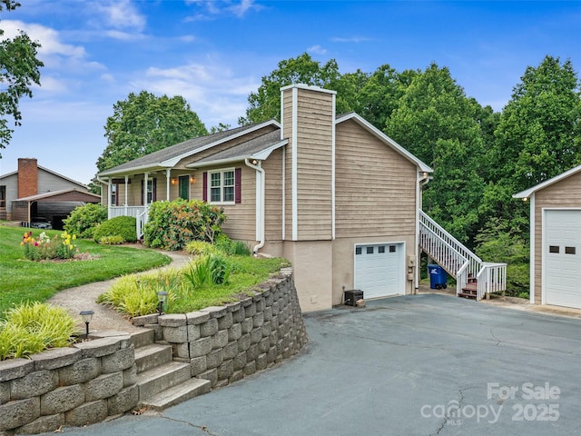 321 Jupiter Rd, Weaverville, NC 28787 - view of property exterior with stairway, covered porch, and a chimney