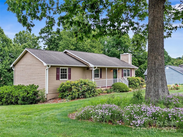 321 Jupiter Rd, Weaverville, NC 28787 - ranch-style house featuring covered porch, a front lawn, a chimney, and a shingled roof