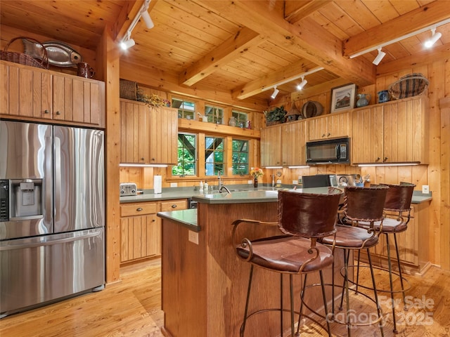 151 Sanctuary Dr, Burnsville, NC 28714 - kitchen with track lighting, stainless steel fridge with ice dispenser, wood ceiling with exposed beams, black microwave, and light wood finished floors