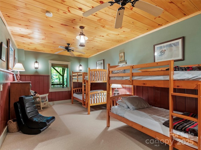 151 Sanctuary Dr, Burnsville, NC 28714 - bedroom with wood ceiling, a wainscoted wall, carpet flooring, ornamental molding, and wood walls