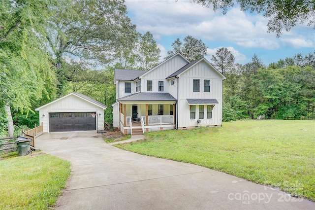 1062 Willow Ridge Ln, Fort Mill, SC 29707 - modern farmhouse featuring board and batten siding, a porch, a garage, a front lawn, and an outdoor structure