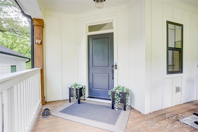 1062 Willow Ridge Ln, Fort Mill, SC 29707 - view of exterior entry with board and batten siding and a deck
