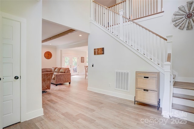 1062 Willow Ridge Ln, Fort Mill, SC 29707 - stairway featuring wood finished floors, baseboards, a high ceiling, beam ceiling, and recessed lighting