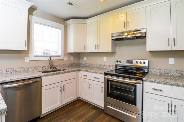 515 Kings Mountain St, Clover, SC 29710 - kitchen featuring under cabinet range hood, stainless steel appliances, a sink, dark wood finished floors, and white cabinets