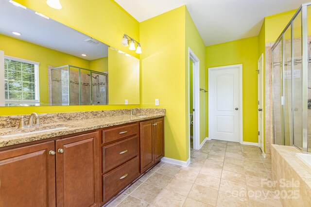 10105 Community House Rd, Charlotte, NC 28277 - full bath featuring a stall shower, double vanity, tile patterned floors, and tiled bath