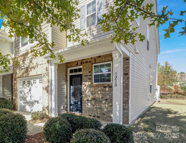 3230 Yarmouth Ln, Gastonia, NC 28056 - doorway to property with a garage and brick siding
