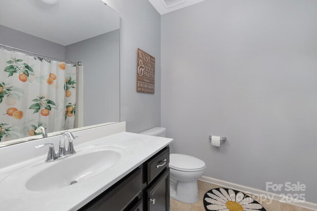 3230 Yarmouth Ln, Gastonia, NC 28056 - bathroom with toilet, vanity, tile patterned floors, baseboards, and a shower with shower curtain