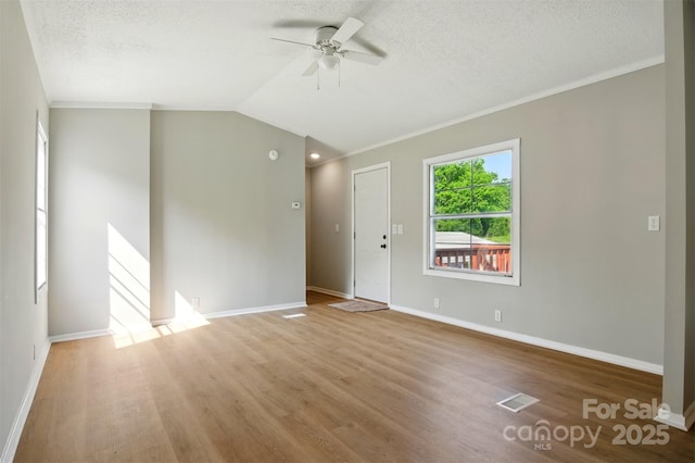 1016 S D Ave, Maiden, NC 28650 - unfurnished living room featuring a ceiling fan, wood finished floors, crown molding, baseboards, and a textured ceiling