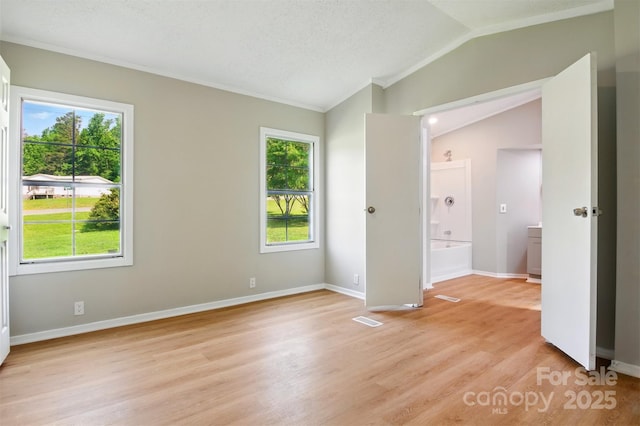 1016 S D Ave, Maiden, NC 28650 - unfurnished room featuring vaulted ceiling, light wood-style floors, baseboards, and ornamental molding