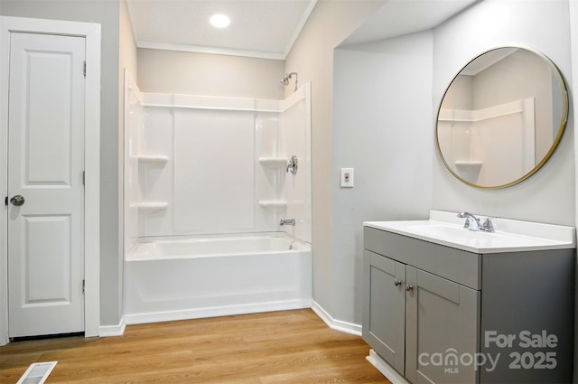 1016 S D Ave, Maiden, NC 28650 - full bathroom with vanity, shower / bath combination, wood finished floors, and baseboards
