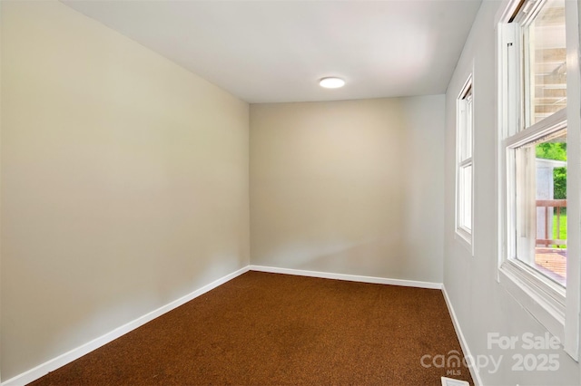 1016 S D Ave, Maiden, NC 28650 - spare room with dark carpet and baseboards