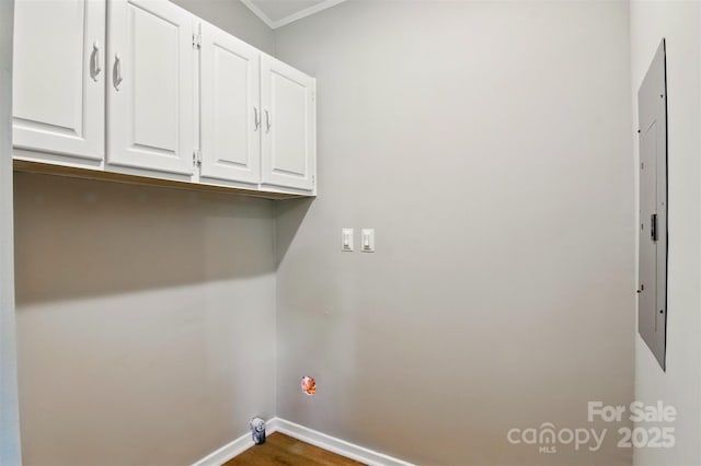 1016 S D Ave, Maiden, NC 28650 - laundry room with baseboards, wood finished floors, cabinet space, ornamental molding, and electric panel