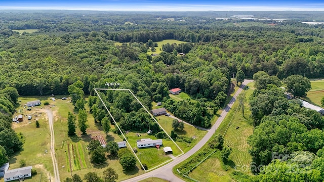 1016 S D Ave, Maiden, NC 28650 - aerial view of property and surrounding area featuring a heavily wooded area and property parcel outlined