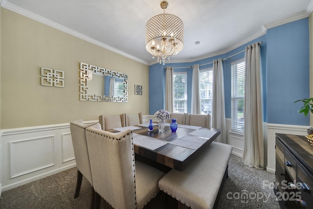 920 Old Forester Ln, Charlotte, NC 28214 - carpeted dining area with a chandelier, ornamental molding, a decorative wall, and a wainscoted wall