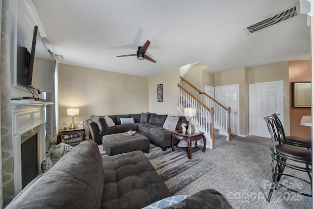 920 Old Forester Ln, Charlotte, NC 28214 - carpeted living room with stairway, ceiling fan, and a fireplace