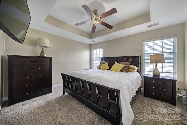 920 Old Forester Ln, Charlotte, NC 28214 - bedroom featuring a raised ceiling, carpet flooring, baseboards, and a ceiling fan
