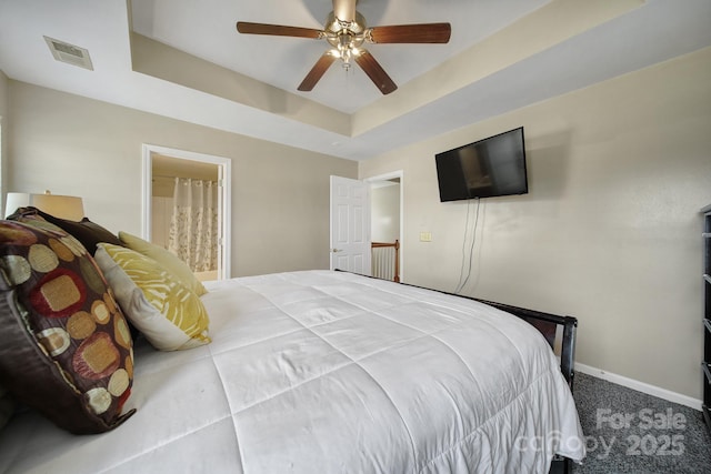 920 Old Forester Ln, Charlotte, NC 28214 - bedroom with a raised ceiling, baseboards, carpet floors, a ceiling fan, and ensuite bathroom