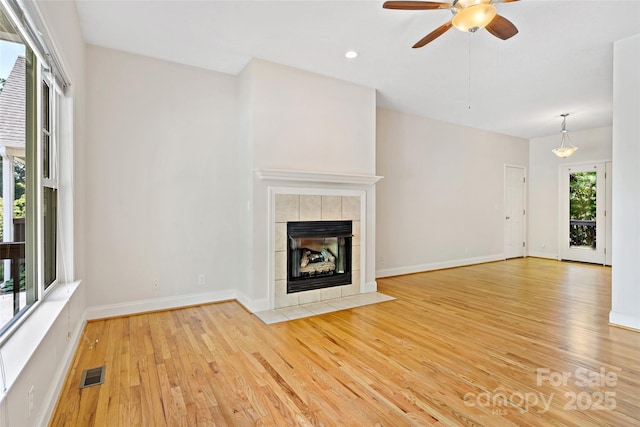 1 Teresa Way, Black Mountain, NC 28711 - unfurnished living room featuring light wood-type flooring, ceiling fan, baseboards, a tile fireplace, and recessed lighting