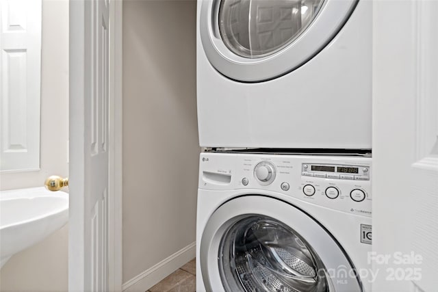 1 Teresa Way, Black Mountain, NC 28711 - laundry room with stacked washer / dryer, baseboards, and tile patterned flooring