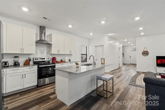 2813 Ava Ave, Charlotte, NC 28208 - kitchen with electric stove, wall chimney range hood, a sink, open floor plan, and dark wood-style floors