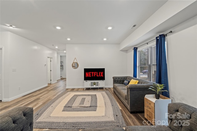 2813 Ava Ave, Charlotte, NC 28208 - living area featuring wood finished floors, recessed lighting, baseboards, and a fireplace
