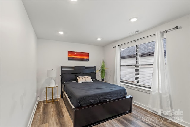 2813 Ava Ave, Charlotte, NC 28208 - bedroom with wood finished floors, baseboards, and recessed lighting