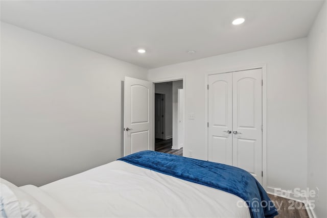 2813 Ava Ave, Charlotte, NC 28208 - bedroom with dark wood-style floors, recessed lighting, baseboards, and a closet
