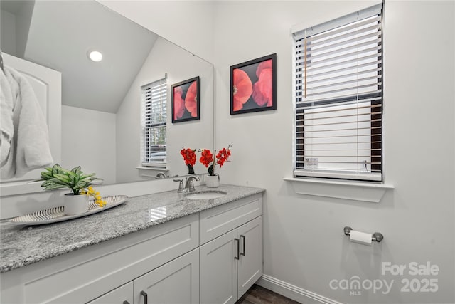 2813 Ava Ave, Charlotte, NC 28208 - bathroom with vanity, vaulted ceiling, recessed lighting, and wood finished floors