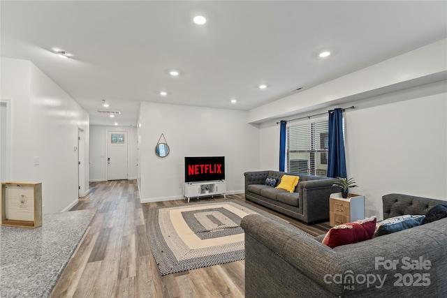 2813 Ava Ave, Charlotte, NC 28208 - living room with wood finished floors, recessed lighting, and baseboards