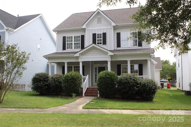 19834 Davidson Concord Rd, Davidson, NC 28036 - view of front of property with a shingled roof, a porch, and a front lawn