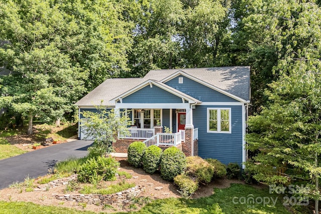 411 French Partridge Ln, Biltmore Lake, NC 28715 - craftsman-style house featuring a porch and driveway