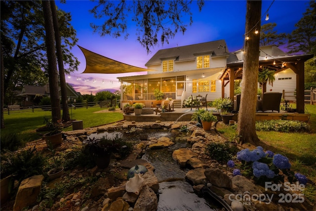 738 Rocky Hollow Trl, Clover, SC 29710 - back of house with a patio area and a sunroom