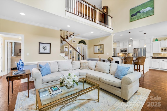 738 Rocky Hollow Trl, Clover, SC 29710 - living area featuring ornamental molding, a high ceiling, stairway, dark wood finished floors, and recessed lighting