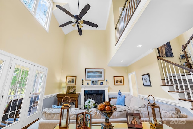 738 Rocky Hollow Trl, Clover, SC 29710 - living area featuring a towering ceiling, stairway, a ceiling fan, healthy amount of natural light, and french doors