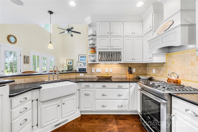 738 Rocky Hollow Trl, Clover, SC 29710 - kitchen featuring stainless steel range with gas cooktop, a sink, dark countertops, a ceiling fan, and custom exhaust hood