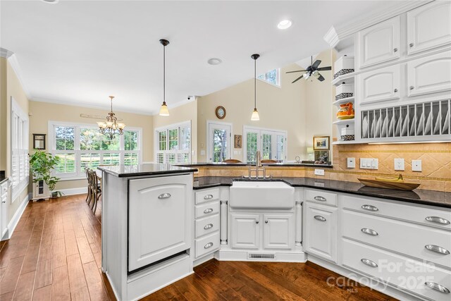 738 Rocky Hollow Trl, Clover, SC 29710 - kitchen featuring a sink, a peninsula, a chandelier, white cabinets, and hanging light fixtures