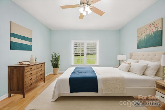 117 Chandler Dr, Mocksville, NC 27028 - bedroom featuring light wood-type flooring, baseboards, and ceiling fan