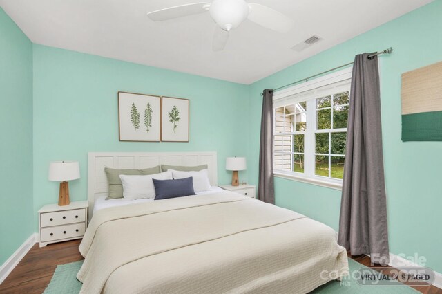 117 Chandler Dr, Mocksville, NC 27028 - bedroom featuring dark wood-style flooring, baseboards, and ceiling fan
