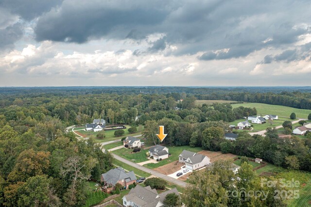117 Chandler Dr, Mocksville, NC 27028 - aerial overview of property's location with a heavily wooded area and nearby suburban area
