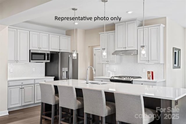 1817 Ab Moore Jr Dr Unit 3240, Indian Trail, NC 28079 - kitchen featuring a sink, stainless steel appliances, a breakfast bar, a kitchen island with sink, and recessed lighting