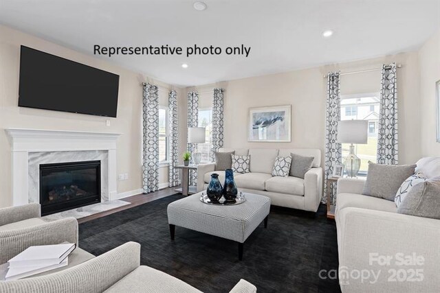 1817 Ab Moore Jr Dr Unit 3240, Indian Trail, NC 28079 - living area featuring recessed lighting, a high end fireplace, baseboards, and dark wood finished floors