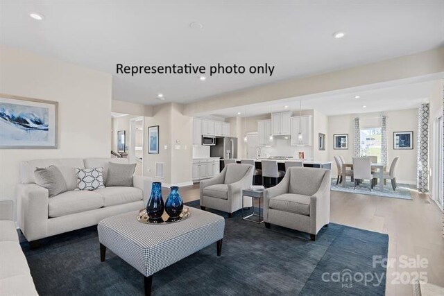 1817 Ab Moore Jr Dr Unit 3240, Indian Trail, NC 28079 - living room with wood finished floors, baseboards, and recessed lighting
