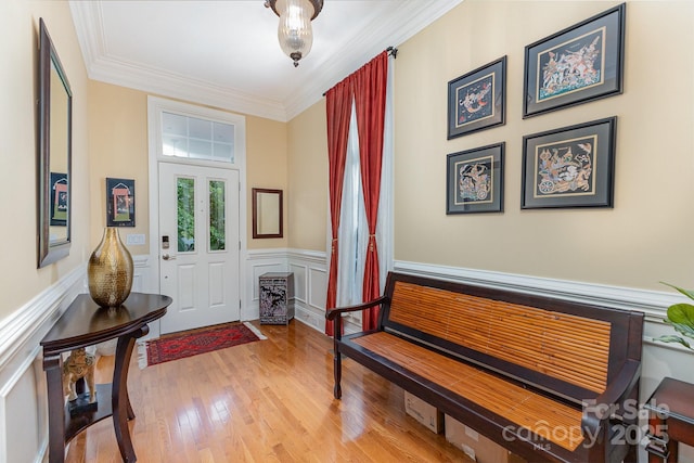 9210 Ginhouse Ln, Charlotte, NC 28277 - entryway featuring a wainscoted wall, ornamental molding, and wood finished floors
