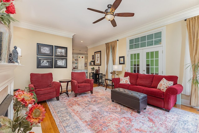 9210 Ginhouse Ln, Charlotte, NC 28277 - living room with ornamental molding, a ceiling fan, wood finished floors, a fireplace, and recessed lighting