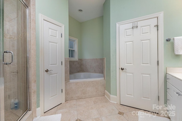 9210 Ginhouse Ln, Charlotte, NC 28277 - full bath featuring a stall shower, a garden tub, tile patterned flooring, and vanity