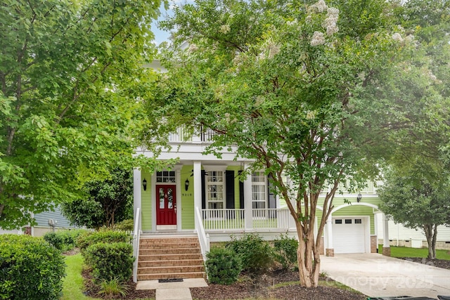 9210 Ginhouse Ln, Charlotte, NC 28277 - obstructed view of property with covered porch, driveway, and a garage