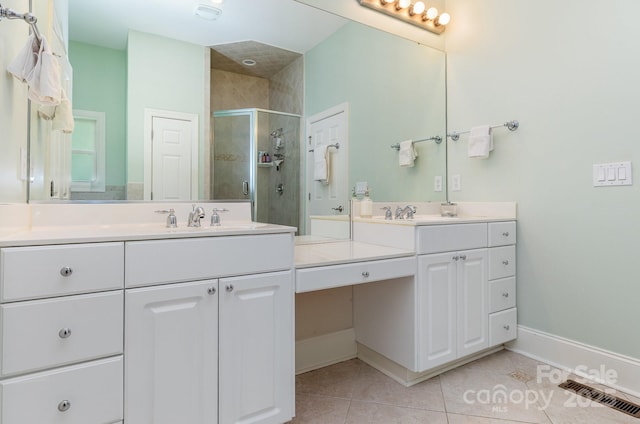 9210 Ginhouse Ln, Charlotte, NC 28277 - bathroom featuring a shower stall, tile patterned flooring, and vanity